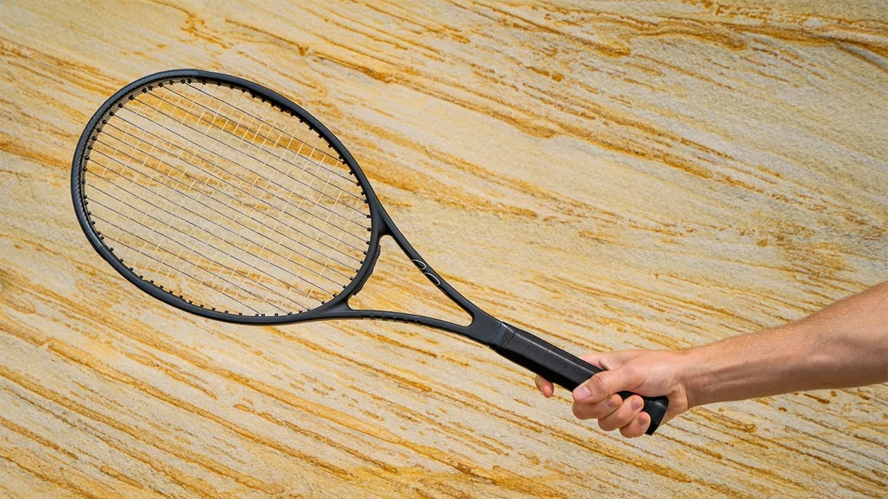 Why does a heavier tennis racket give you more power?